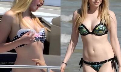 Avril Lavigne disfrutando del mar y tomando el sol, luciendo un bikini y gafas oscuras, mostrando su estilo actual a los 41 años.