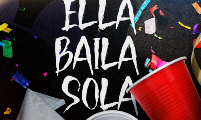 Portada oficial de la canción “Ella Baila Sola” de Eslabón Armado y Peso Pluma, mostrando vasos de fiesta y confeti con el título al centro.