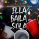 Portada oficial de la canción “Ella Baila Sola” de Eslabón Armado y Peso Pluma, mostrando vasos de fiesta y confeti con el título al centro.