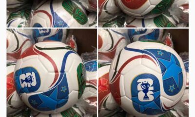 Balón Trionda oficial del Mundial 2026, con diseño en rojo, verde y azul que representa a Canadá, México y Estados Unidos, sobre fondo blanco con bordes dorados.