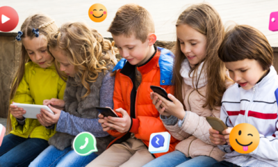 Niños utilizando teléfonos y tabletas mientras interactúan con íconos de redes sociales, representando el uso digital temprano.