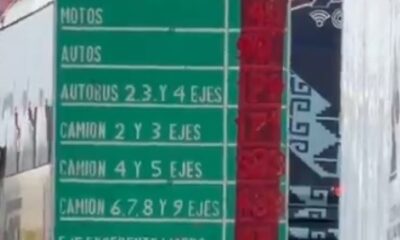 Señal de caseta con tarifas cubiertas parcialmente con cinta tras aumento de precios