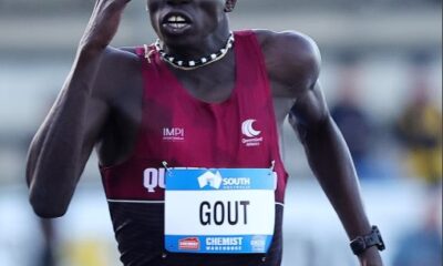 Atleta corriendo en competencia de velocidad en prueba de 200 metros