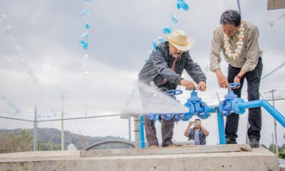 Inauguración del sistema de agua entubada en San Miguel Tecuanipa, Tochimilco, con cárcamo de bombeo y tanques de captación para mejorar el suministro de agua potable.